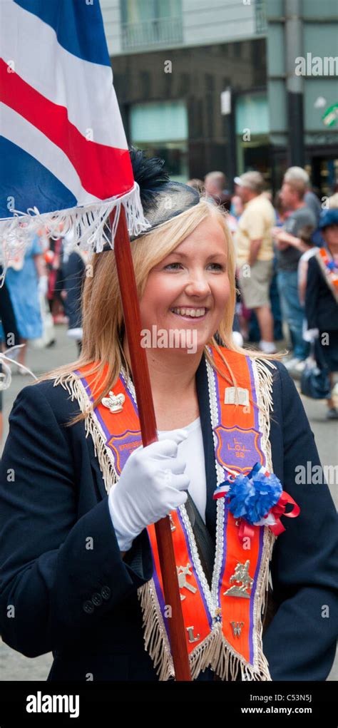 woman walking along orange parade